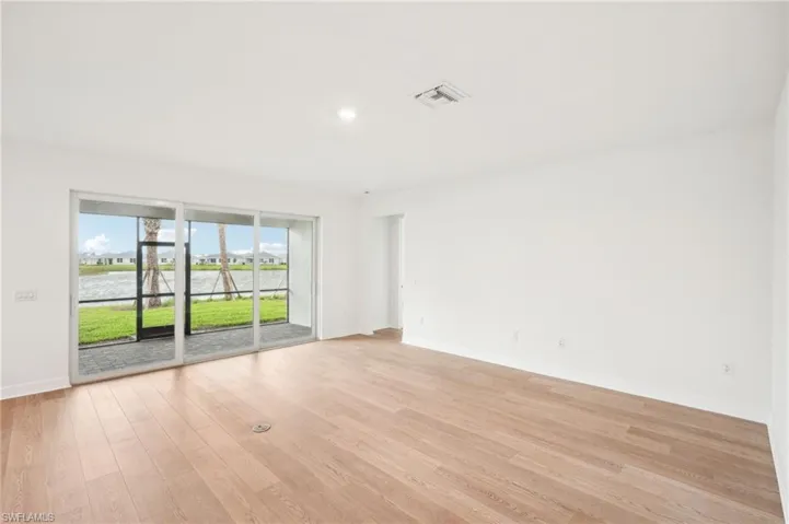 Unfurnished room with light wood-type flooring