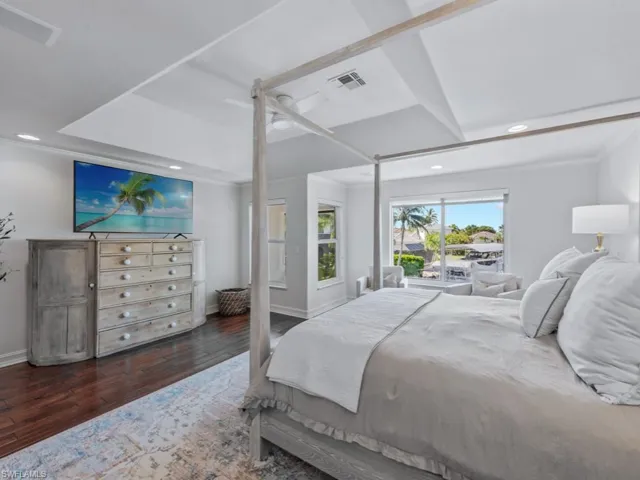 Bedroom featuring recessed lighting, wood finished floors, ornamental molding, and a ceiling fan