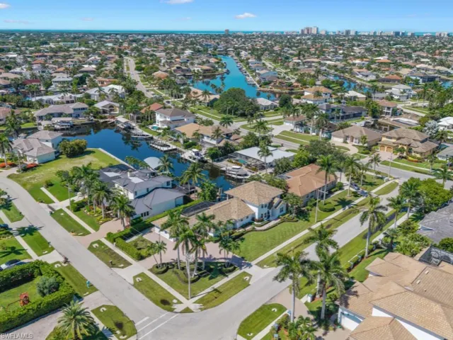 Aerial overview of property's location featuring nearby suburban area and a large body of water