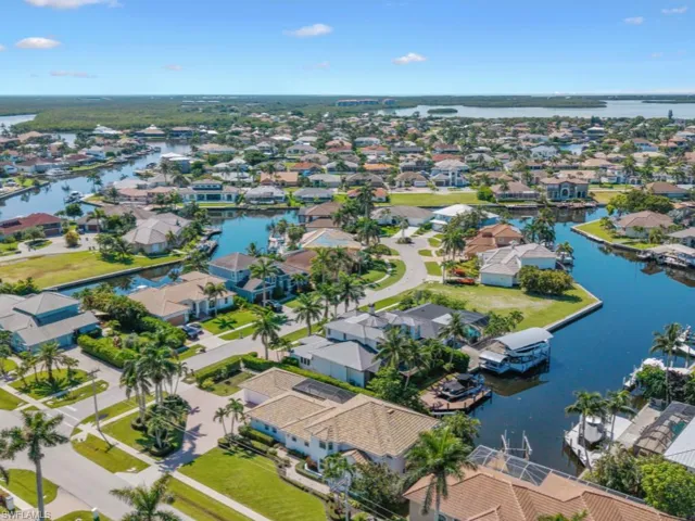 Aerial perspective of suburban area with a large body of water