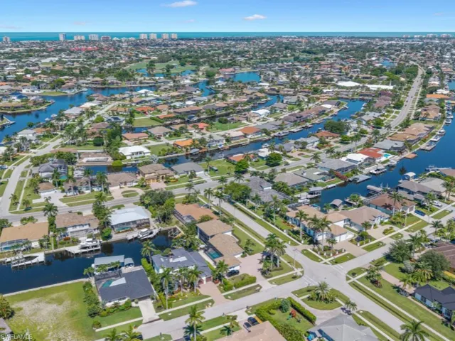 Aerial overview of property's location with nearby suburban area