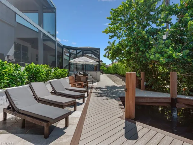 Wooden terrace featuring a lanai