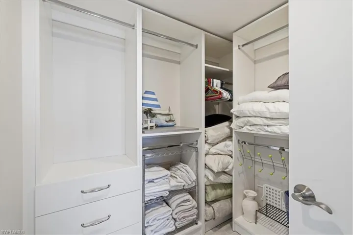 Primary Closet with built in shelving