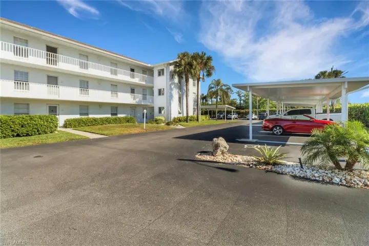View of building exterior featuring a carport