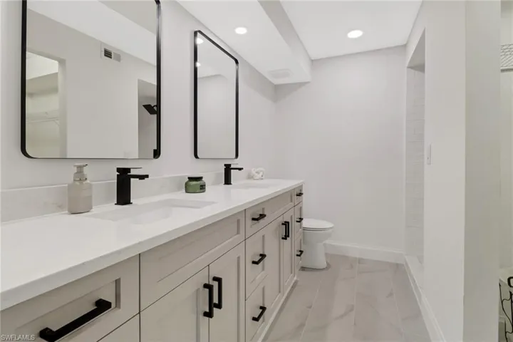 Bathroom with vanity and toilet