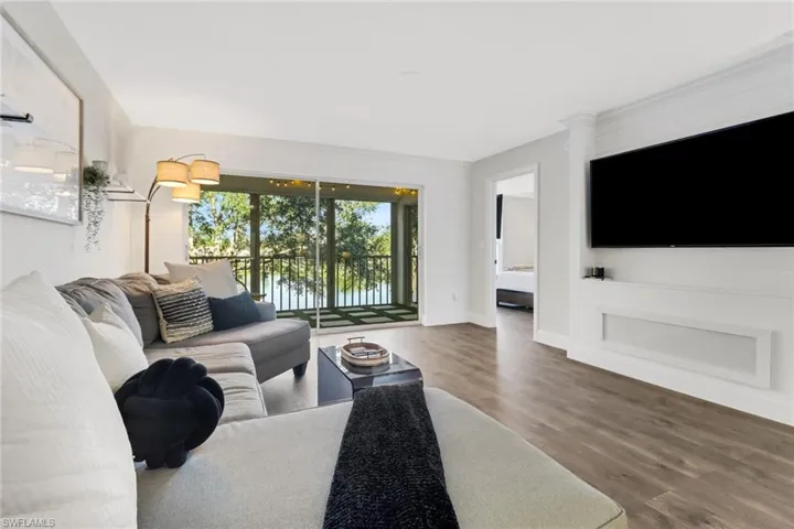 Living room with hardwood / wood-style floors