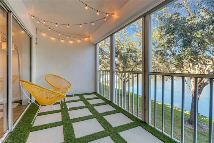 Unfurnished sunroom with a water view