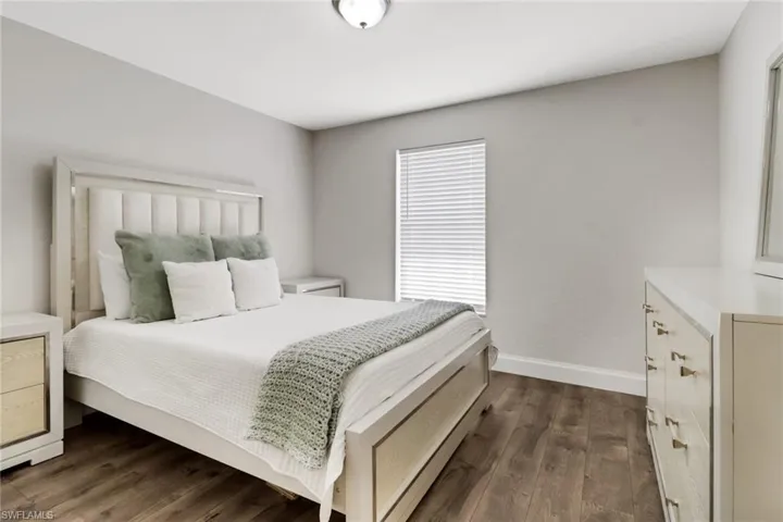 Bedroom featuring dark wood-type flooring