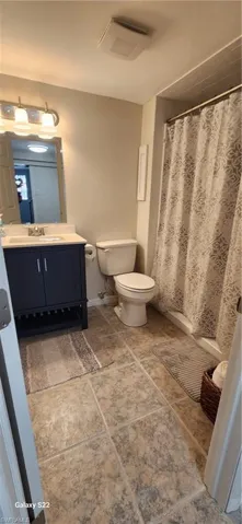 Bathroom with vanity and toilet