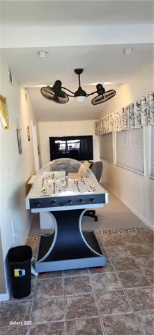Recreation room featuring ceiling fan
