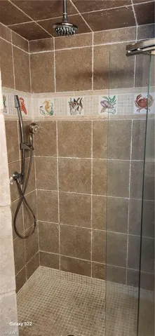 Bathroom with tiled shower