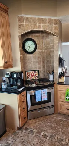 Kitchen with stainless steel electric stove