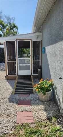View of doorway to property by the pool