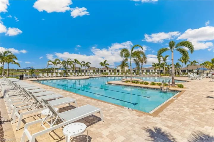 Community pool with a patio