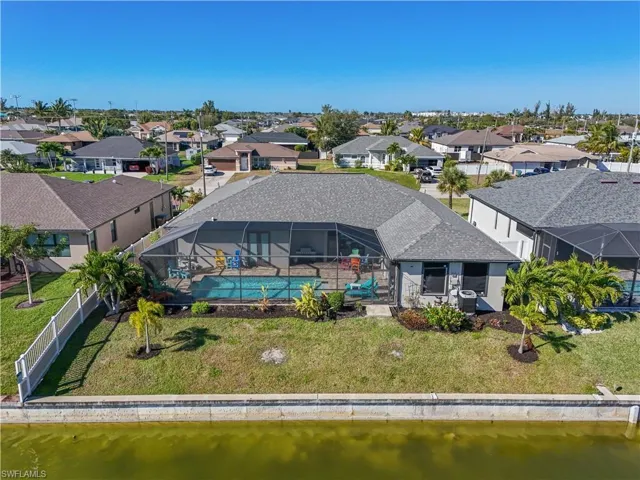 Aerial view of residential area with a large body of water
