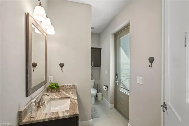Bathroom featuring vanity and light tile patterned floors