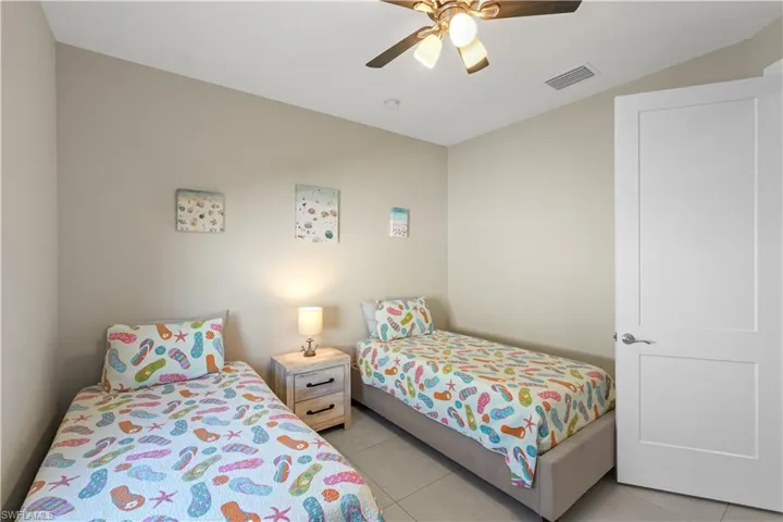 Bedroom featuring ceiling fan and light tile patterned floors