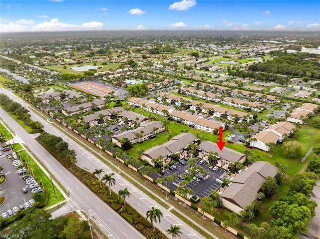 View of property location with a nearby body of water and nearby suburban area