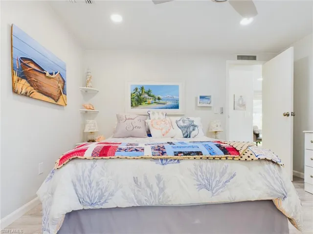 Bedroom with ceiling fan and light hardwood / wood-style floors