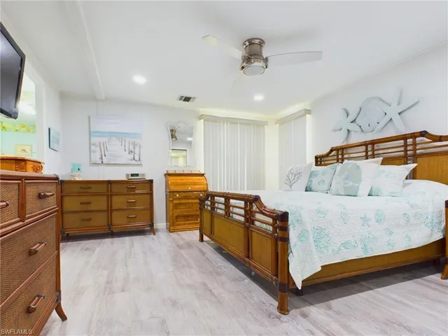 Bedroom featuring light hardwood / wood-style flooring and ceiling fan
