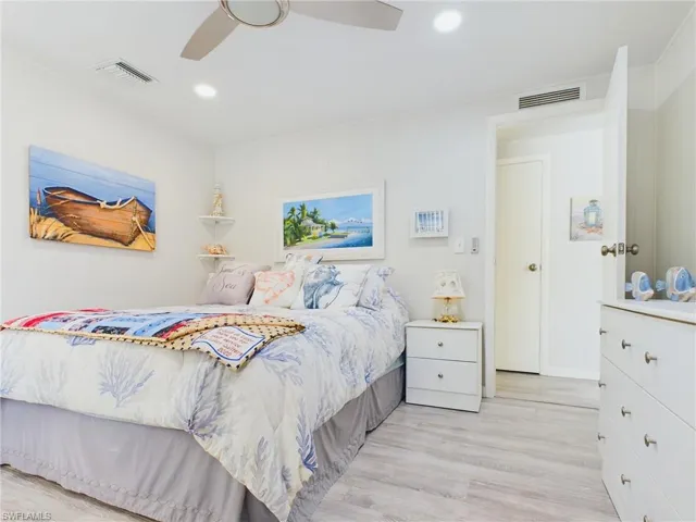 Bedroom featuring ceiling fan and light hardwood / wood-style floors