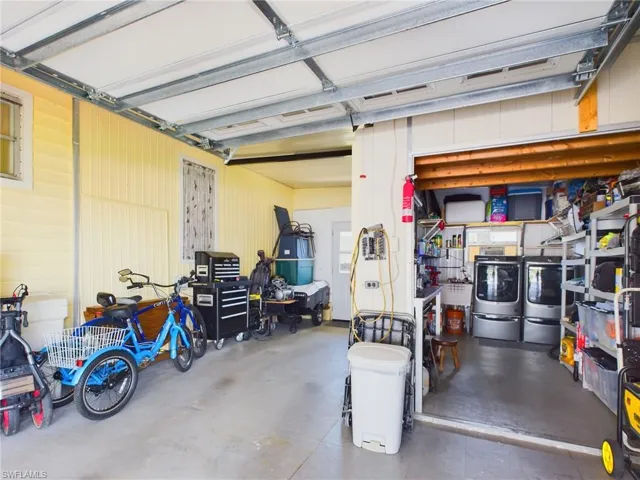 Garage with washer and clothes dryer