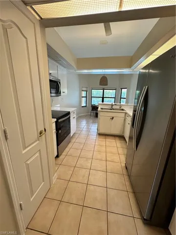 Unfurnished bedroom with carpet, ceiling fan, and a closet