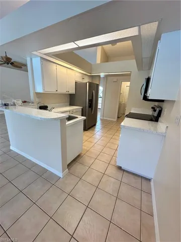 Spacious closet with tile patterned floors