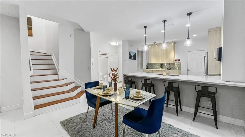 Tiled dining space with sink