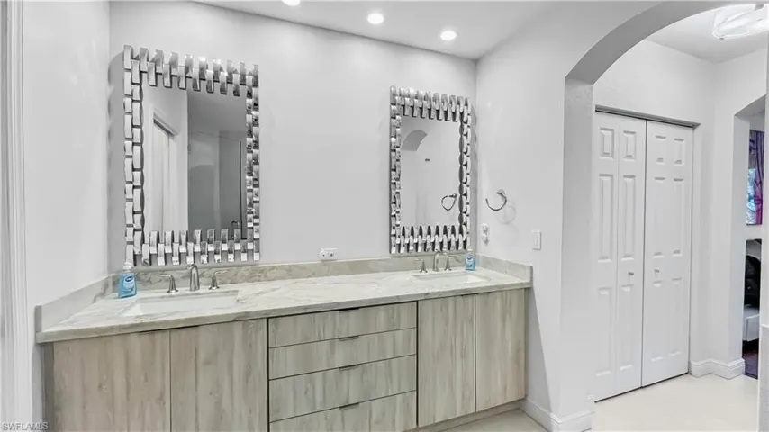 Bathroom with vanity and tile patterned flooring