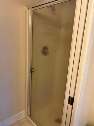 Master Bath features private commode and shower area with pocket door