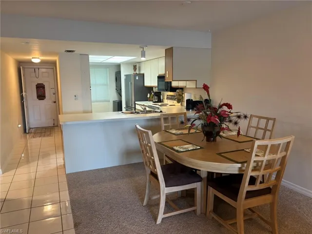 Kitchen overlooks Dining area. Makes entertaining or serving easier