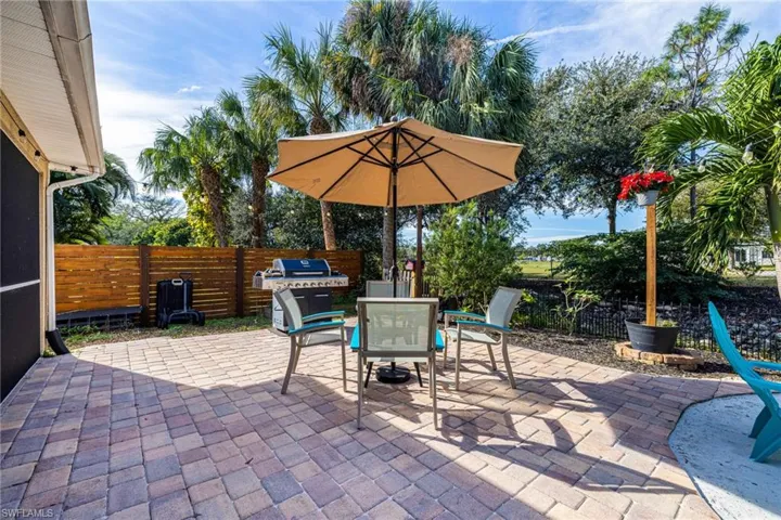 View of patio featuring area for grilling