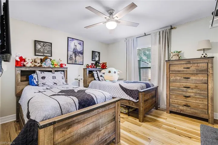 Bedroom featuring ceiling fan and light hardwood / wood-style floors