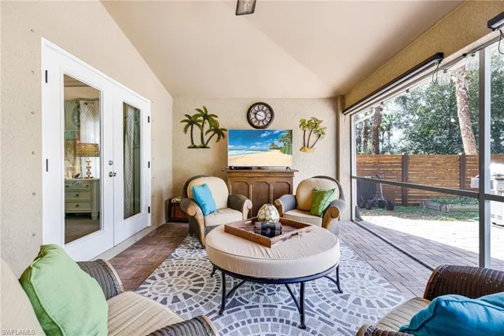 Sunroom / solarium with french doors and lofted ceiling