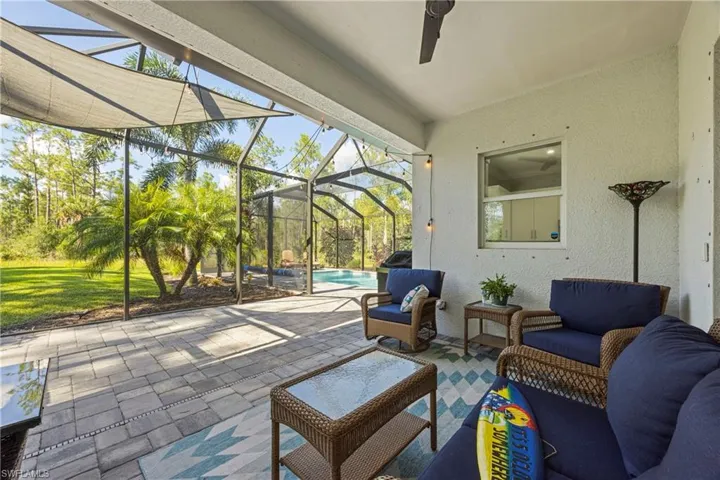 Sunroom with a patio area, outdoor lounge area, plenty of natural light, and ceiling fan