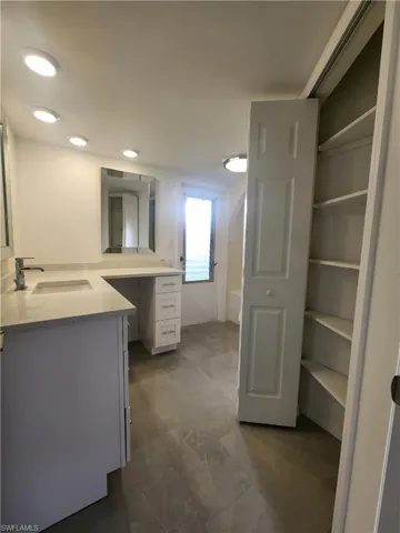 Guest Bathroom with Linen Closet and Lanai Entrance