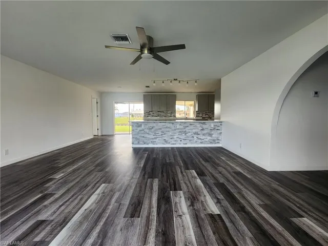 Open concept Living Kitchen area with new ceiling lights and fanand Kitchen