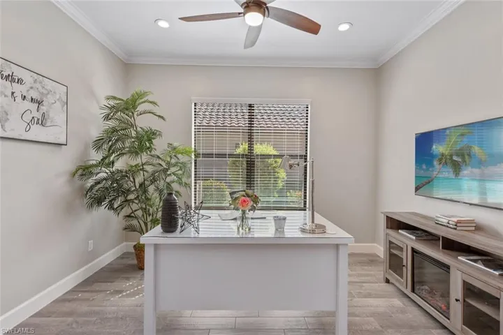 Soak up the Florida sunshine in this stunning custom pool, complete with a raised waterfall spa and tranquil views of the lake beyond. The panoramic screen enclosure maximizes your connection to the peaceful, natural surroundings.