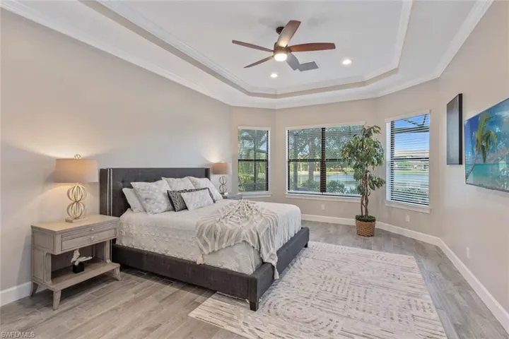 With lush landscaping and a serene lake as your backdrop, this private pool and spa retreat offers both visual beauty and quiet serenity—enhanced by the unobstructed views provided by the panoramic screen enclosure.