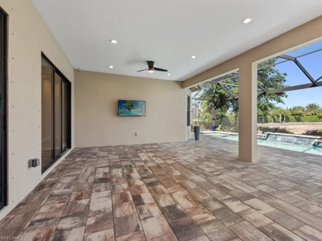 Comfortable ensuite guest bedroom featuring brand new carpet, crown molding, and a ceiling fan for added comfort. The private attached bath offers convenience and privacy, making it an ideal retreat for guests.