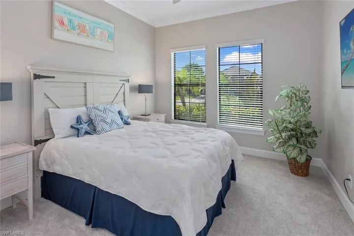 The spa-like primary bath features dual vanities with granite countertops, elegant cabinetry, and modern chrome fixtures. A private enclosed water closet offers added comfort and privacy, while the adjacent spacious walk-in closet provides ample storage and convenience.
