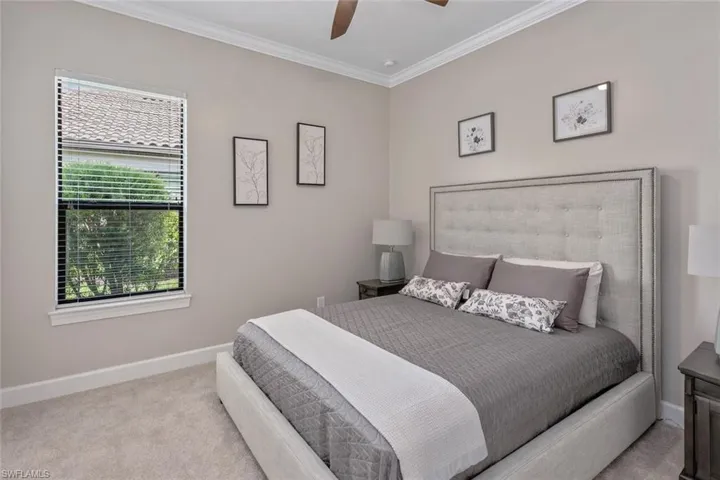 This private outdoor space offers serene water views framed by lush landscaping and mature trees. With no golf course or recreational courts behind you, this setting ensures a quiet escape perfect for relaxation or peaceful morning coffee.