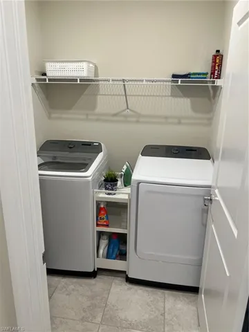 Laundry area with washing machine and clothes dryer