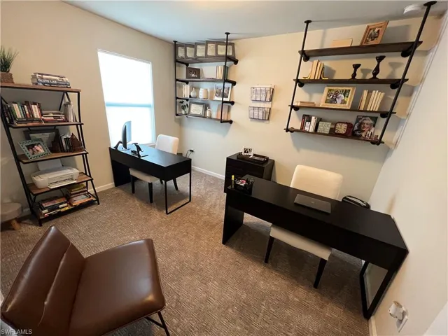 Office space featuring carpet flooring