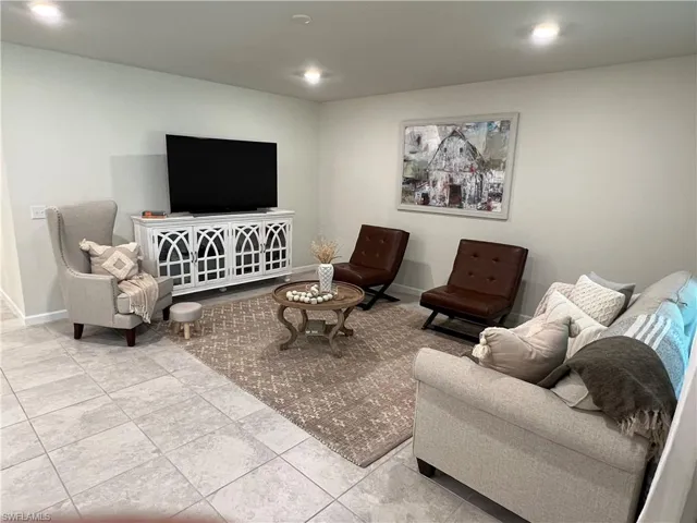 Living room featuring light tile patterned floors