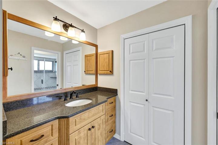Master bathroom features updated vanity, lots of storage and separate wet area