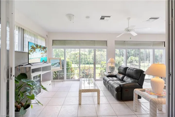 Sunroom featuring with a healthy amount of sunlight
