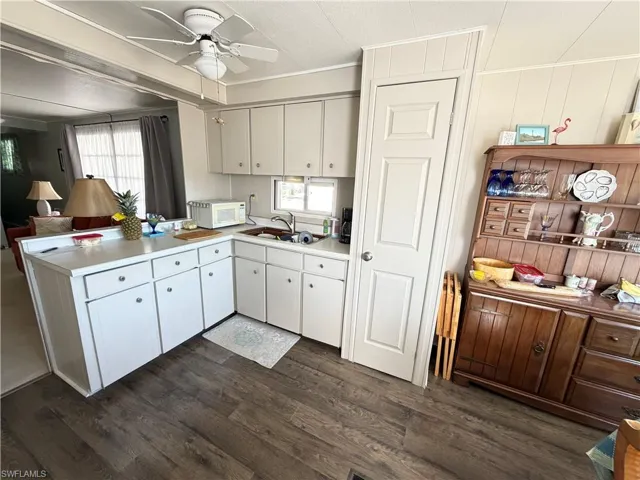 Open Kitchen with wood flooring.