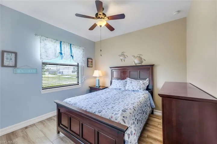 Bedroom featuring ceiling fan and light hardwood / wood-style floors